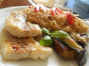 Alaskan fish fillets with tomato & garlic rice