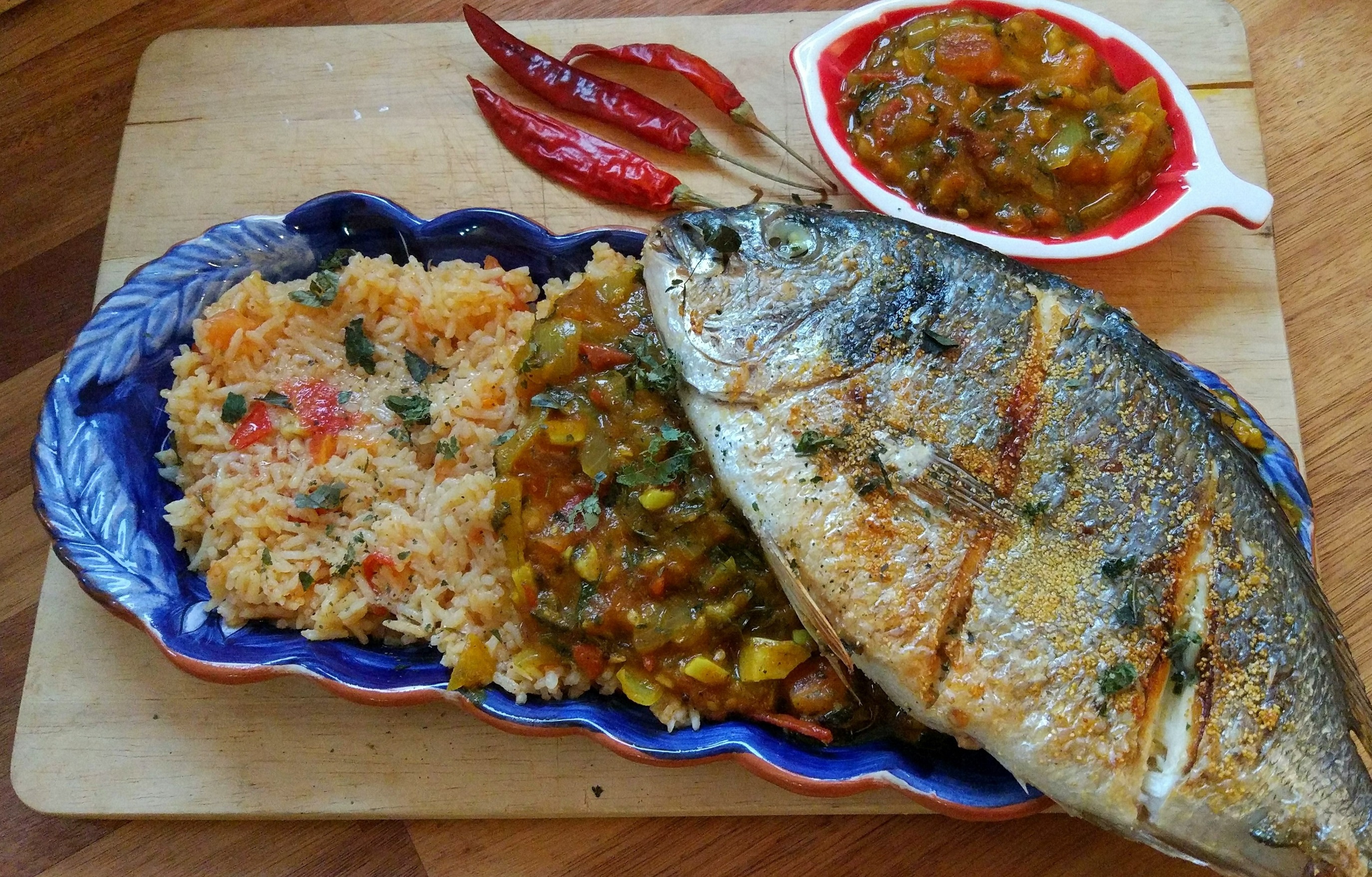 Fried Dorado with Portuguese tomato rice and Indian fish curry